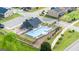 Community pool with a playground and lounge chairs at 667 Edgar # 26, Hampton, GA 30228