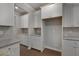 Kitchen boasts white cabinets, granite countertops, and additional storage at 659 Edgar Dr # 24, Hampton, GA 30228