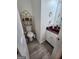 Small bathroom with updated vanity and wood-look flooring at 98 Gleneagles Dr, Fayetteville, GA 30215
