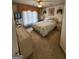 Spacious bedroom with large window and carpeted floor at 98 Gleneagles Dr, Fayetteville, GA 30215
