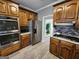 Modern kitchen featuring stainless steel appliances and wood cabinetry at 98 Gleneagles Dr, Fayetteville, GA 30215