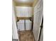 Convenient laundry room with washer, dryer, and cabinets at 98 Gleneagles Dr, Fayetteville, GA 30215