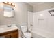 Bathroom with tub, toilet and updated vanity at 1471 Cedar Creek Ln, Riverdale, GA 30296