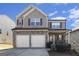 Two-story house with two-car garage and stone accents at 3967 Otter Dam Ct, Atlanta, GA 30349