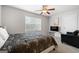 Comfortable bedroom with a queen bed and sitting area at 209 Enfield Ln, Mcdonough, GA 30252