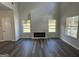 Living room with hardwood floors and a fireplace at 30 Barton Lane # 18, Covington, GA 30016