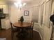 Charming dining room with a round table and hardwood floors at 323 Wood Rdg, Peachtree City, GA 30269