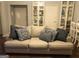 Living room with a neutral colored couch and built in shelving at 323 Wood Rdg, Peachtree City, GA 30269