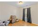 Empty bedroom with gray curtains and wood floors at 247 Island Shoals Rd, Covington, GA 30016