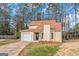 Two-story house with a brown roof and a white garage door at 1458 Walnut Log Pl, Austell, GA 30168