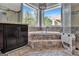 Spa-like bathroom with corner soaking tub and large window at 2089 Highway 85 S, Fayetteville, GA 30215