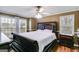 Main bedroom with sleigh bed and hardwood floors at 295 W Hwy 5, Roopville, GA 30170