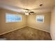 Spacious bedroom with ceiling fan and carpet flooring at 10214 Allen Sw Dr, Covington, GA 30014