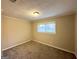Bright bedroom with neutral walls and carpet flooring at 10214 Allen Sw Dr, Covington, GA 30014