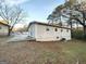 Side view of the house showing a patio and yard at 10214 Allen Sw Dr, Covington, GA 30014