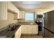 Updated kitchen with white cabinets and granite countertops at 10214 Allen Sw Dr, Covington, GA 30014