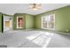 Large finished basement bedroom with ceiling fan and window at 240 Edna Ruth Ln, Mcdonough, GA 30253