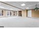 Finished basement featuring a wood burning stove and carpet at 240 Edna Ruth Ln, Mcdonough, GA 30253