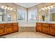 Double vanity bathroom with soaking tub and tiled floors at 240 Edna Ruth Ln, Mcdonough, GA 30253