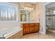 Bathroom with soaking tub, double vanity, and walk-in shower at 240 Edna Ruth Ln, Mcdonough, GA 30253