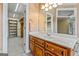Vanity with access to walk-in closet and additional shelves at 240 Edna Ruth Ln, Mcdonough, GA 30253