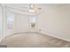 Bright bedroom featuring carpet and multiple windows at 240 Edna Ruth Ln, Mcdonough, GA 30253