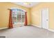 Spacious bedroom with carpeting and window with red curtains at 240 Edna Ruth Ln, Mcdonough, GA 30253