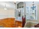 Two-story foyer with hardwood floors, chandelier, and bay window at 240 Edna Ruth Ln, Mcdonough, GA 30253