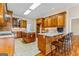 Kitchen with island, stainless steel appliances, and wood cabinets at 240 Edna Ruth Ln, Mcdonough, GA 30253