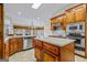 Kitchen with island, stainless steel appliances, and wood cabinets at 240 Edna Ruth Ln, Mcdonough, GA 30253
