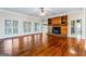 Spacious living room with hardwood floors and fireplace at 240 Edna Ruth Ln, Mcdonough, GA 30253