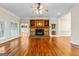 Living room with hardwood floors, fireplace, and built-in shelves at 240 Edna Ruth Ln, Mcdonough, GA 30253