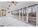 Spacious screened porch with wood flooring and wooded views at 240 Edna Ruth Ln, Mcdonough, GA 30253