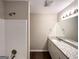 Bathroom with shower and granite double vanity at 1641 Ne Riverchase Ln, Conyers, GA 30013