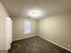 Spacious carpeted bedroom with neutral walls and ample closet space at 1641 Ne Riverchase Ln, Conyers, GA 30013