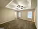 Spacious bedroom with ceiling fan and neutral carpeting at 1641 Ne Riverchase Ln, Conyers, GA 30013