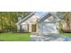 Charming one-story house with attached garage and well-manicured lawn at 1641 Ne Riverchase Ln, Conyers, GA 30013