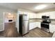 Updated kitchen featuring granite countertops and stainless steel appliances at 1641 Ne Riverchase Ln, Conyers, GA 30013