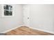 Simple bedroom with hardwood floors and neutral walls at 254 Hardy Rd, Brooks, GA 30205