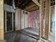 Unfinished basement showing framing and insulation at 2004 Joseph E Boone Nw Blvd, Atlanta, GA 30314