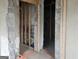 Under construction bathroom with tile floor and framed walls at 2004 Joseph E Boone Nw Blvd, Atlanta, GA 30314