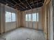 Under construction bedroom with two windows and framed walls at 2004 Joseph E Boone Nw Blvd, Atlanta, GA 30314