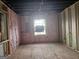 Unfinished bedroom with window and insulation at 2004 Joseph E Boone Nw Blvd, Atlanta, GA 30314
