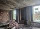 Large bedroom with exposed brick walls and new windows, ready for renovation at 2004 Joseph E Boone Nw Blvd, Atlanta, GA 30314