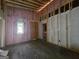 Unfinshed bedroom with exposed framing and insulation at 2004 Joseph E Boone Nw Blvd, Atlanta, GA 30314