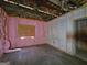 Unfinished bedroom with hardwood floors and pink insulation at 2004 Joseph E Boone Nw Blvd, Atlanta, GA 30314