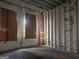 Unfinished bedroom with exposed brick walls and new window openings, ready for renovation at 2004 Joseph E Boone Nw Blvd, Atlanta, GA 30314
