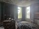 Spacious bedroom with exposed brick walls and large windows, in need of renovation at 2004 Joseph E Boone Nw Blvd, Atlanta, GA 30314