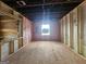Unfinished bedroom with window and wood flooring at 2004 Joseph E Boone Nw Blvd, Atlanta, GA 30314