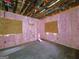 Unfinished bedroom with hardwood floors and pink insulation at 2004 Joseph E Boone Nw Blvd, Atlanta, GA 30314